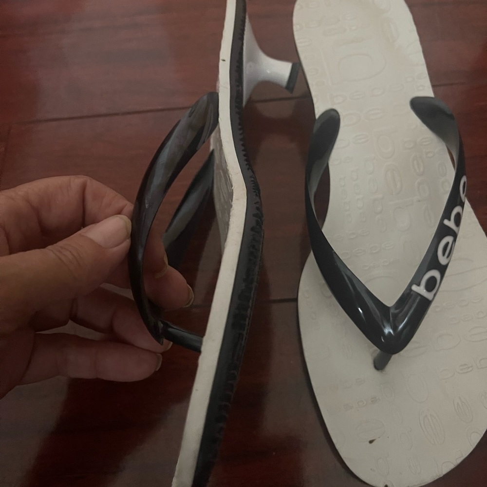 Bebe size 8 rubber thong sandals. Logo on the straps. Black and white color